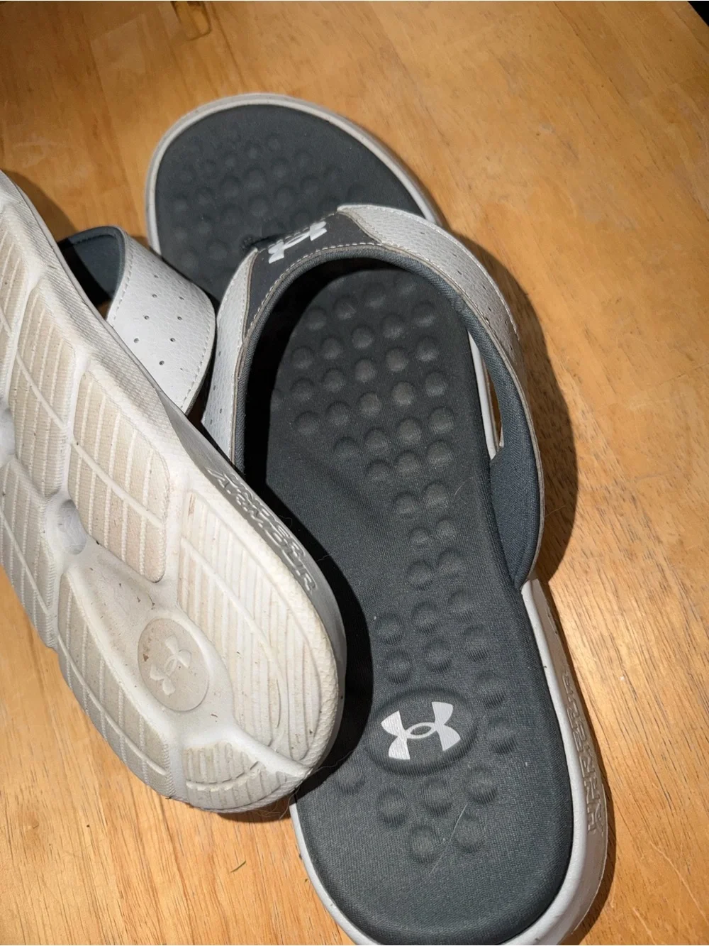 Under Armour men’s flip flops. Size 12. Worn once.